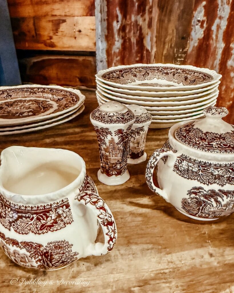 Set of vintage brown and white transferware in antique store.