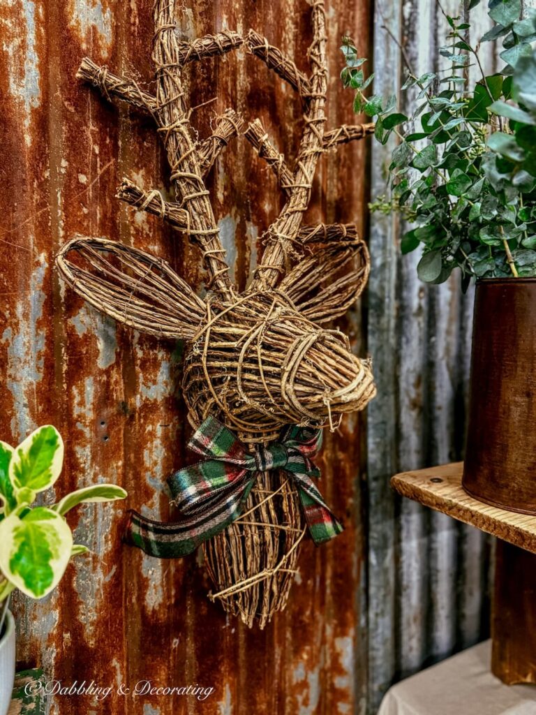 Grapevine reindeer on rustic wall at vintage market days Vermont.