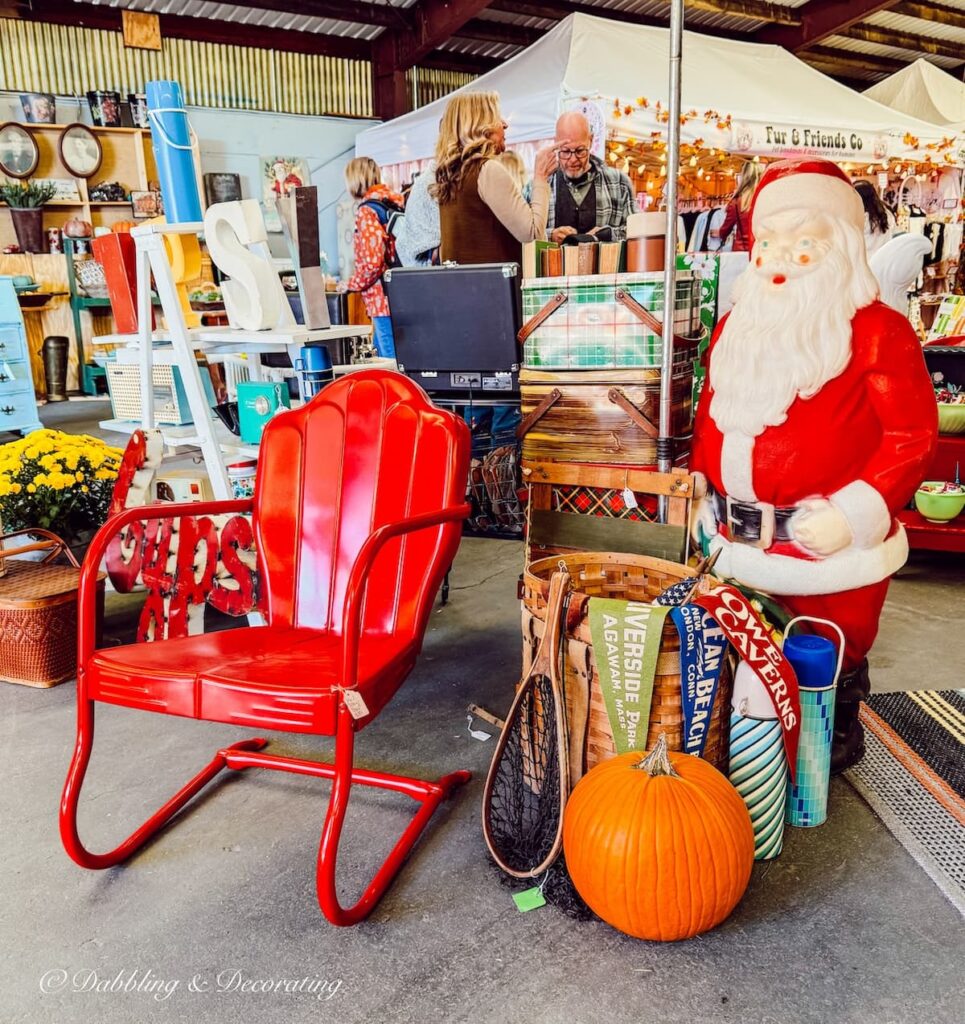 Retro plastic life like Santa Claus in outdoor style cabin vintage Christmas decor ideas at a Vintage Market.