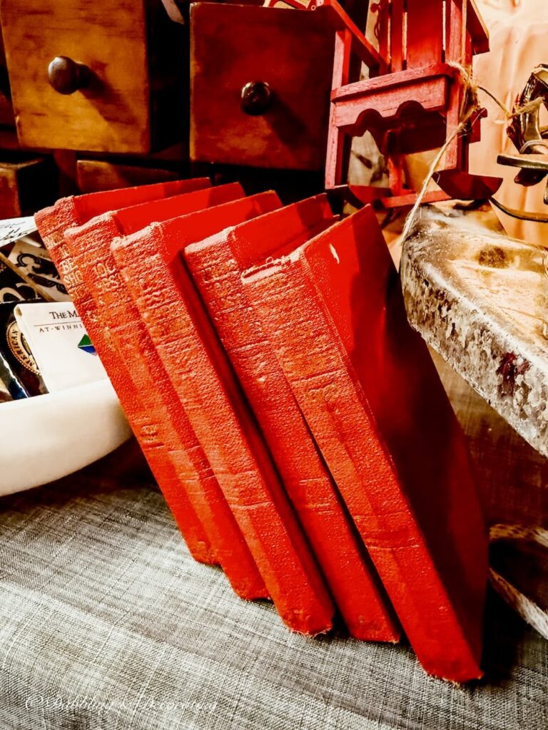Collection of vintage red books for vintage Christmas decor.