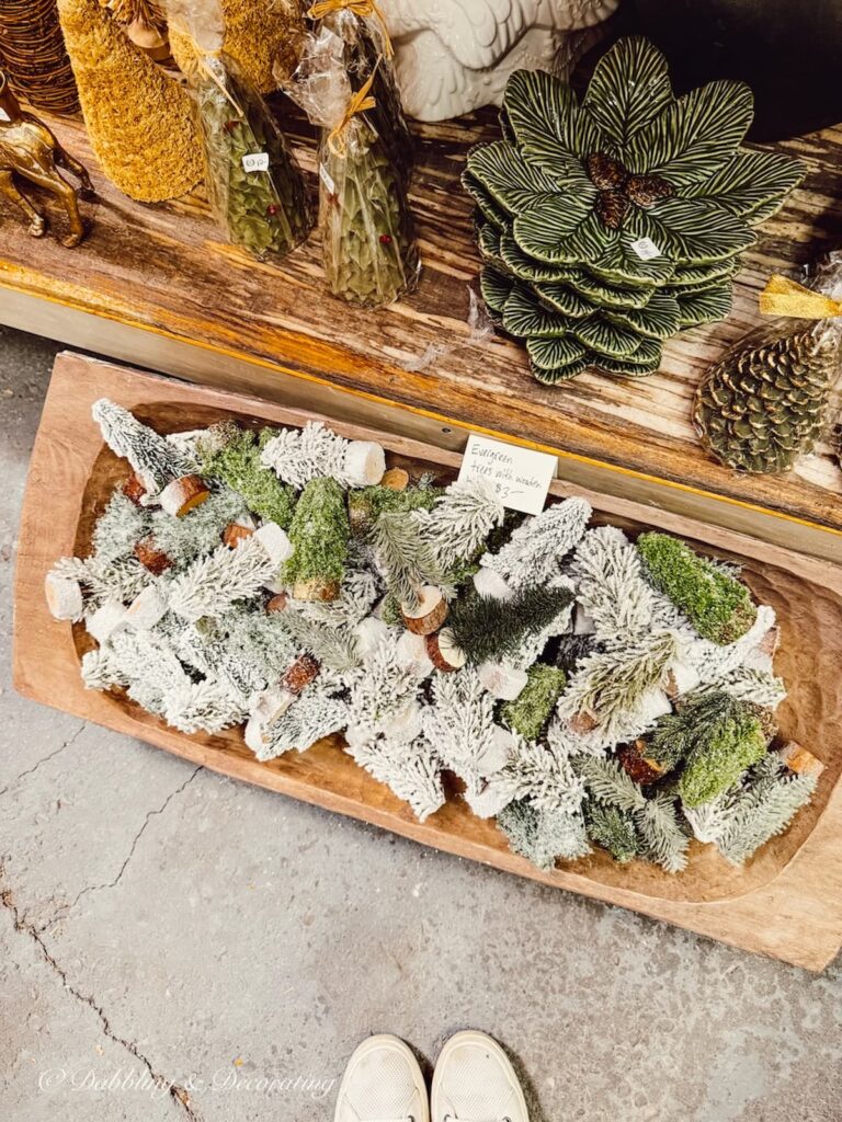Green vintage Christmas decor ideas with bottle brushes, dishwares and pinecones at vintage market days Vermont.