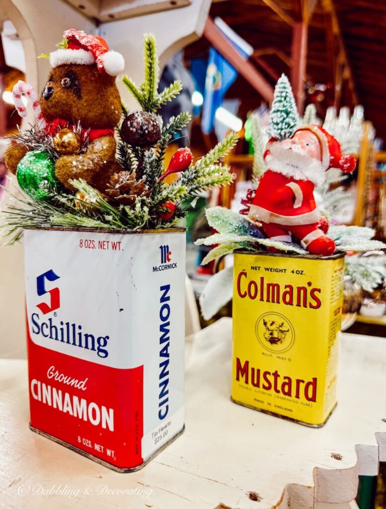 Vintage spice tins decorated for vintage Christmas Decor.