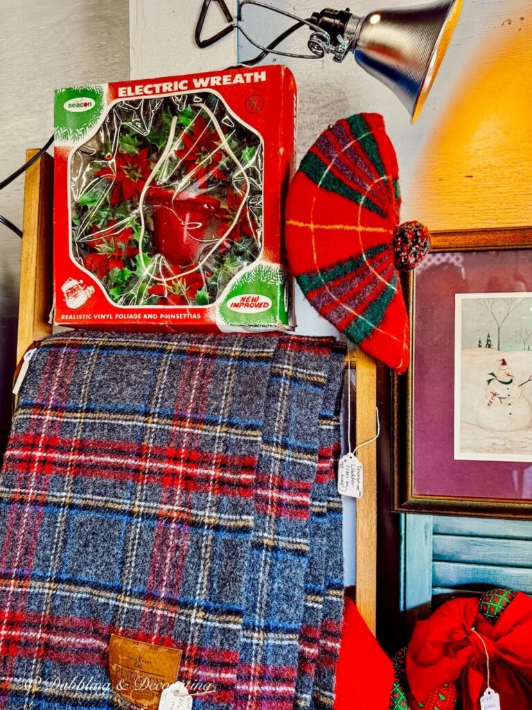 Vintage plaid Scottish hat and plaid blanket with vintage Christmas decorations at Vintage Market Days Vermont.