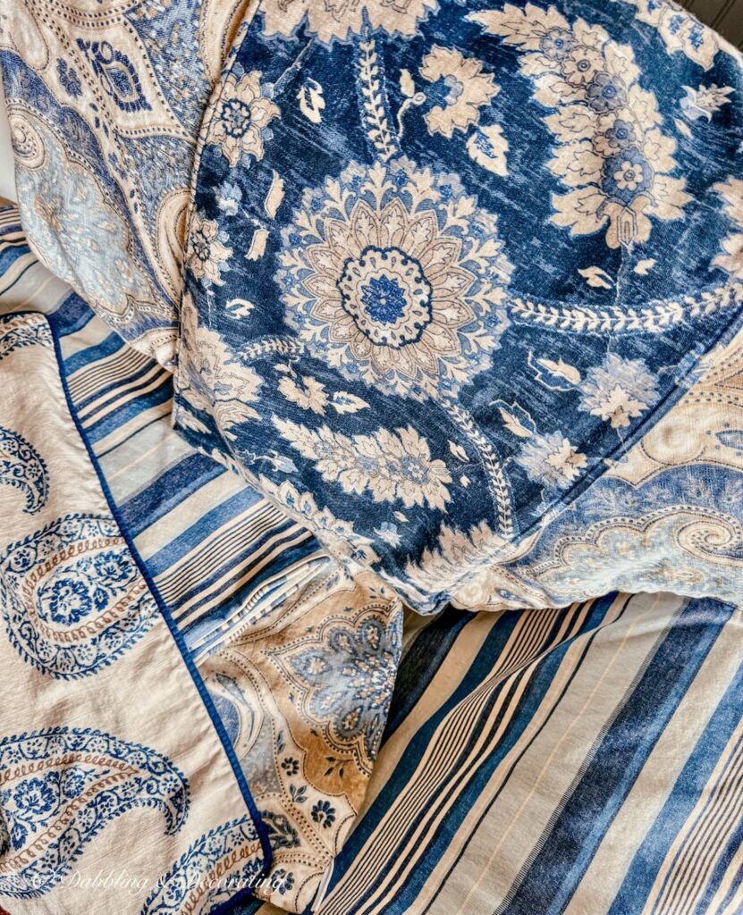 Blue and brown mix and match patterns of custom pillow slipcovers as vintage home decor gifts.