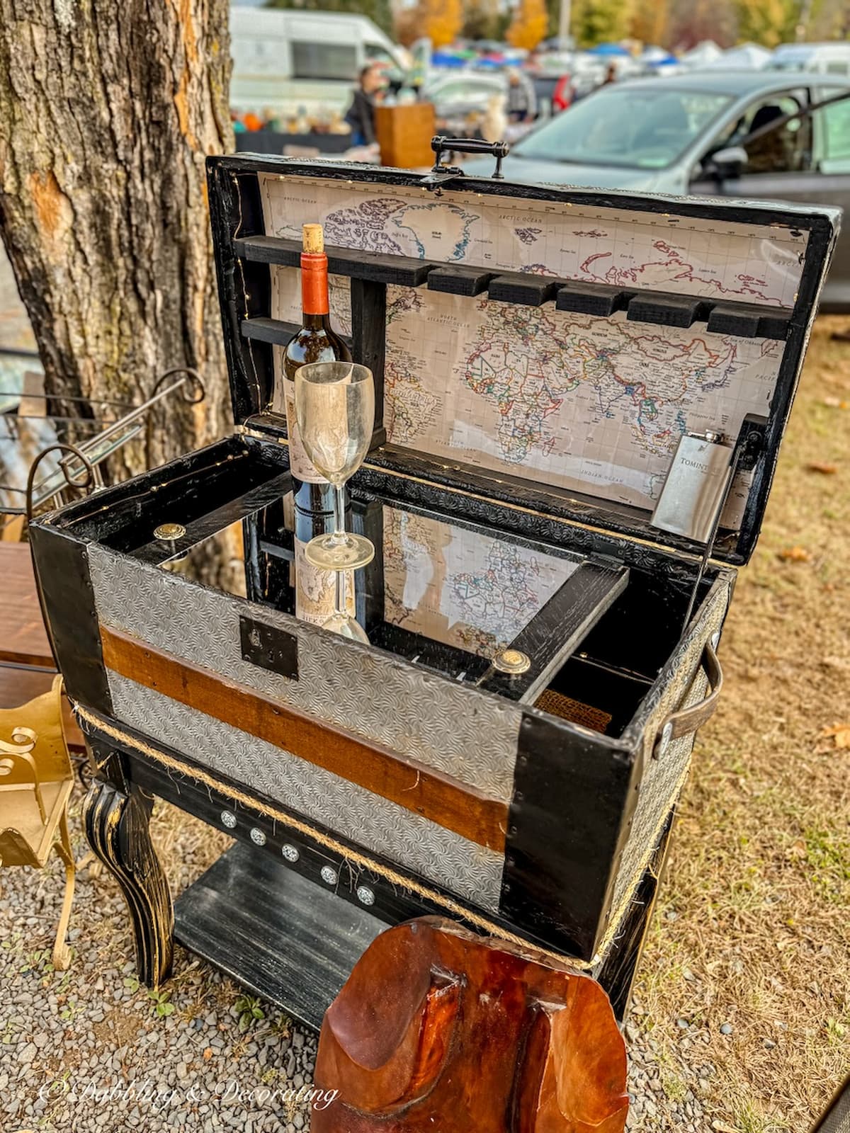 Vintage trunk transformed into a DIY home bar at Elephant's Trunk Flea Market.