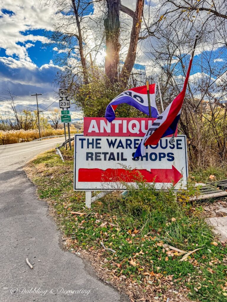 Antique Warehouse Hudson NY open sign on the road's entrance.