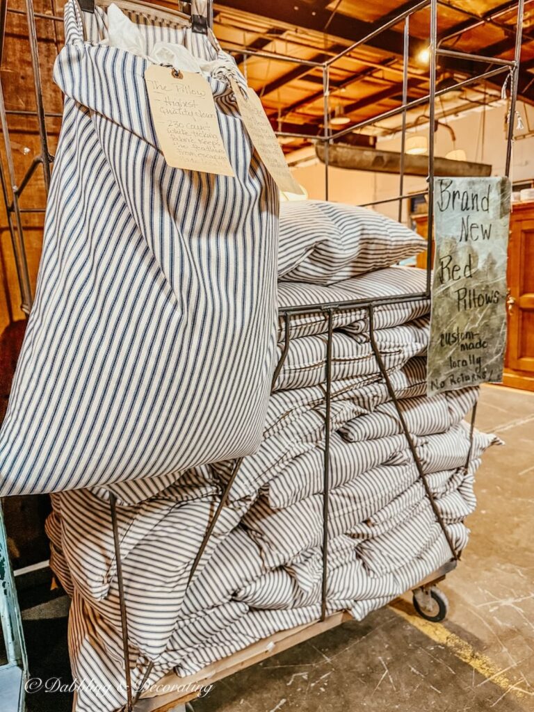 handmade locally farmhouse style blue and white ticking pillows in cases at The Antique Warehouse Hudson NY