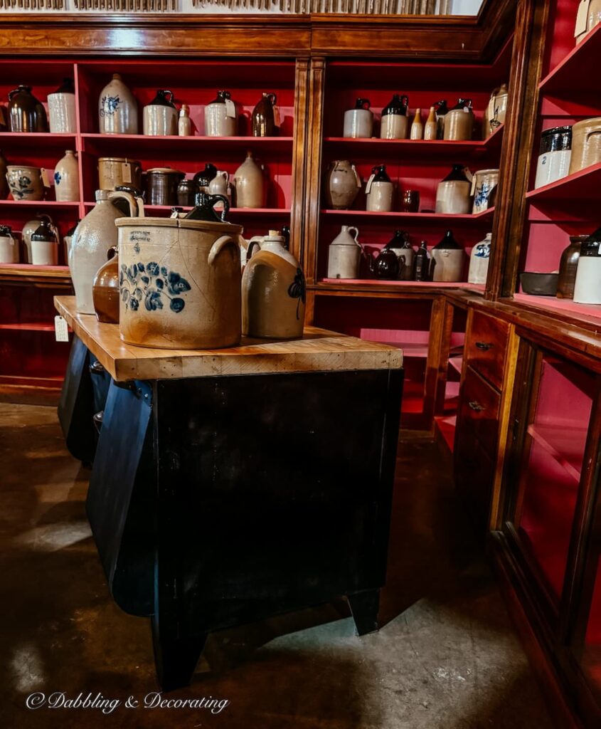 Antique crock displayed on pink wooden shelving at The Antique Warehouse Hudson NY