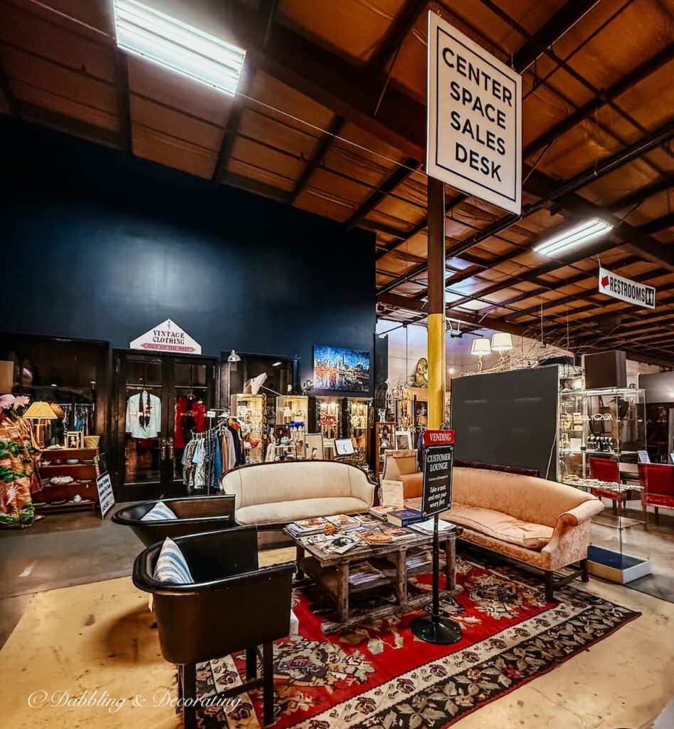 Customer lounge inside The Antique Warehouse in Hudson, NH with couches, chairs, magazines and restrooms.