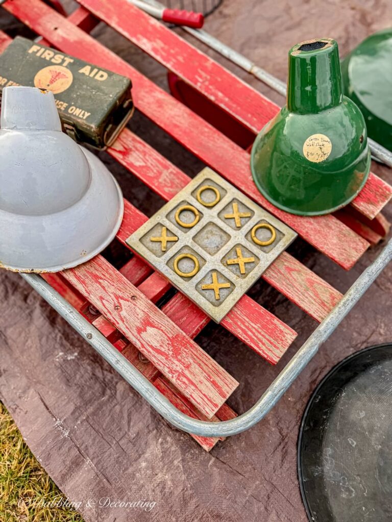 Vintage tick tack tow set on antique red sled at Todd Farm Flea Market.