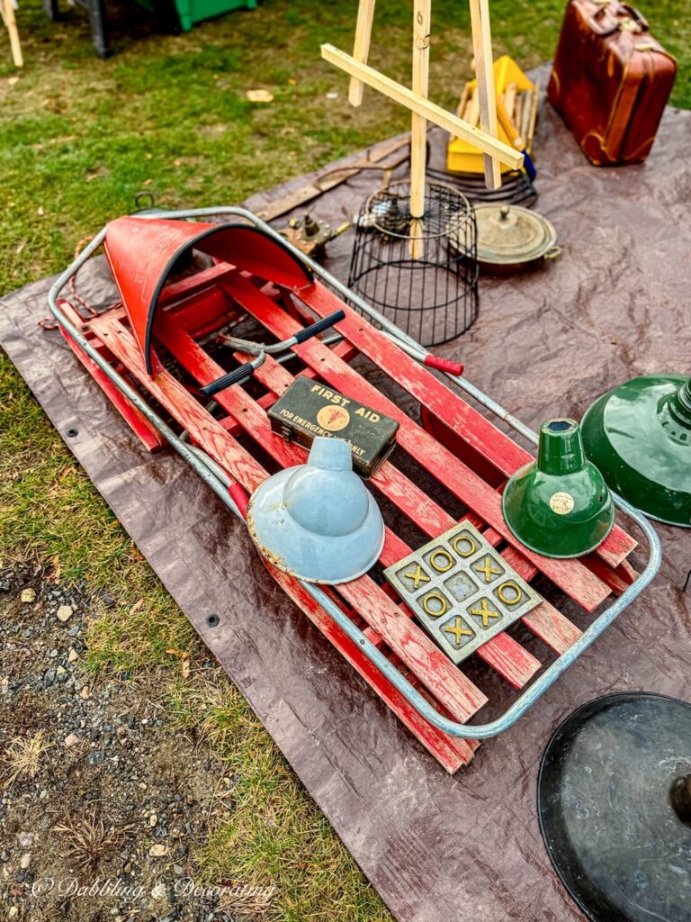 Antique red sled toboggan at Todd Farm Antiques and Flea Market in Rowley, Massachusetts.