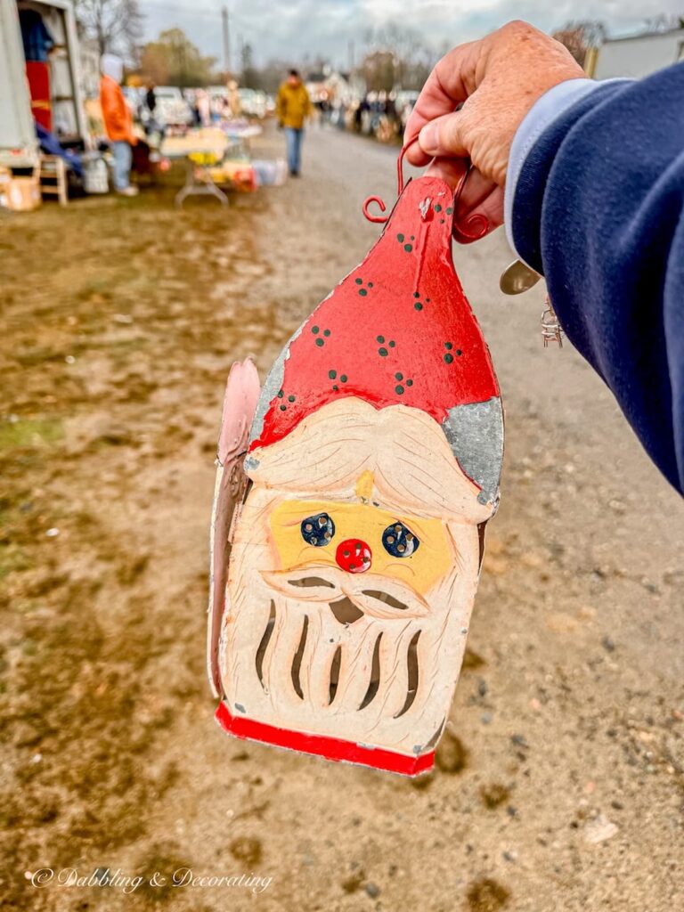 Tin Santa Claus vintage lantern in hand at Todd Farm Flea Market.
