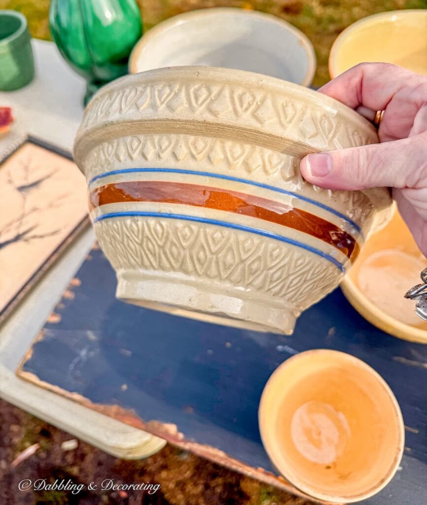 Antique Yellowware bowl in hand at Todd Farm Flea market.