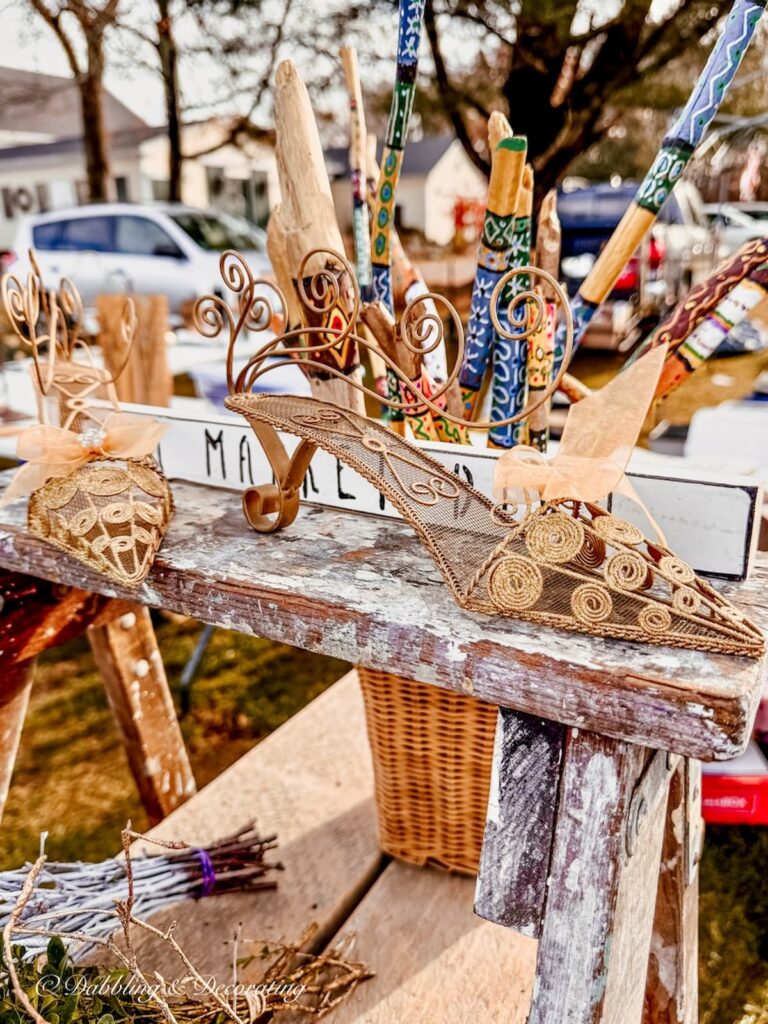 Womens gold shoes made into card or photo holders at Todd Farm Flea Market.