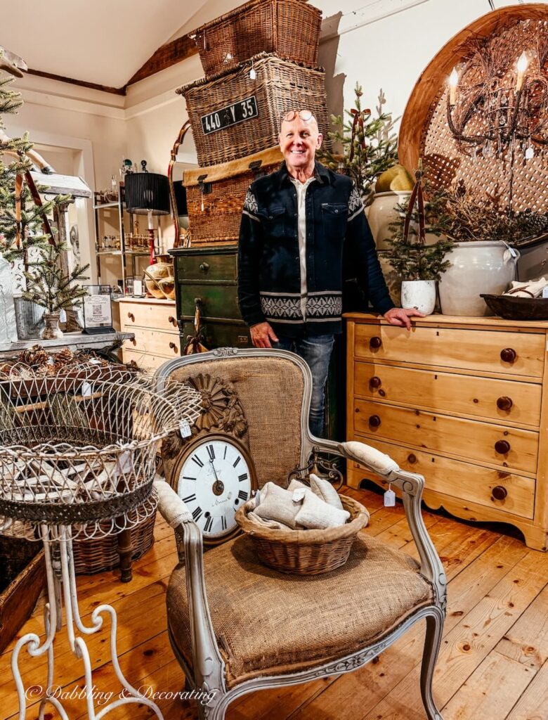 Thomas in front of his Woodland Christmas display inside The Barn at Todd Farm in Rowley, Massachusetts.