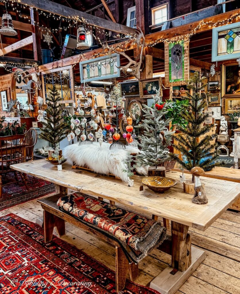 Inside The Barn at Todd Farm in Rowley, Massachusetts, a Christmas display on antique barn table.