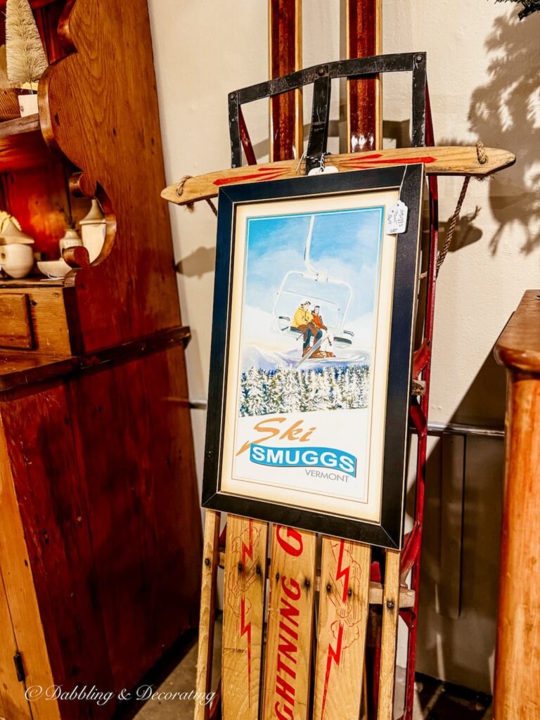 Smuggler's Notch vintage picture hanging on sled at Barge Canal Market antiquing in Burlington, Vermont.