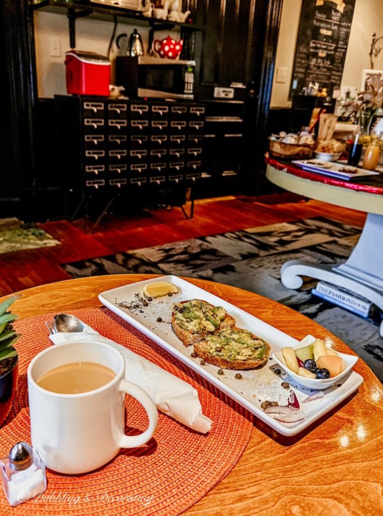 Avocado toast breakfast with coffee inside The Made INN Vermont in Burlington, VT.