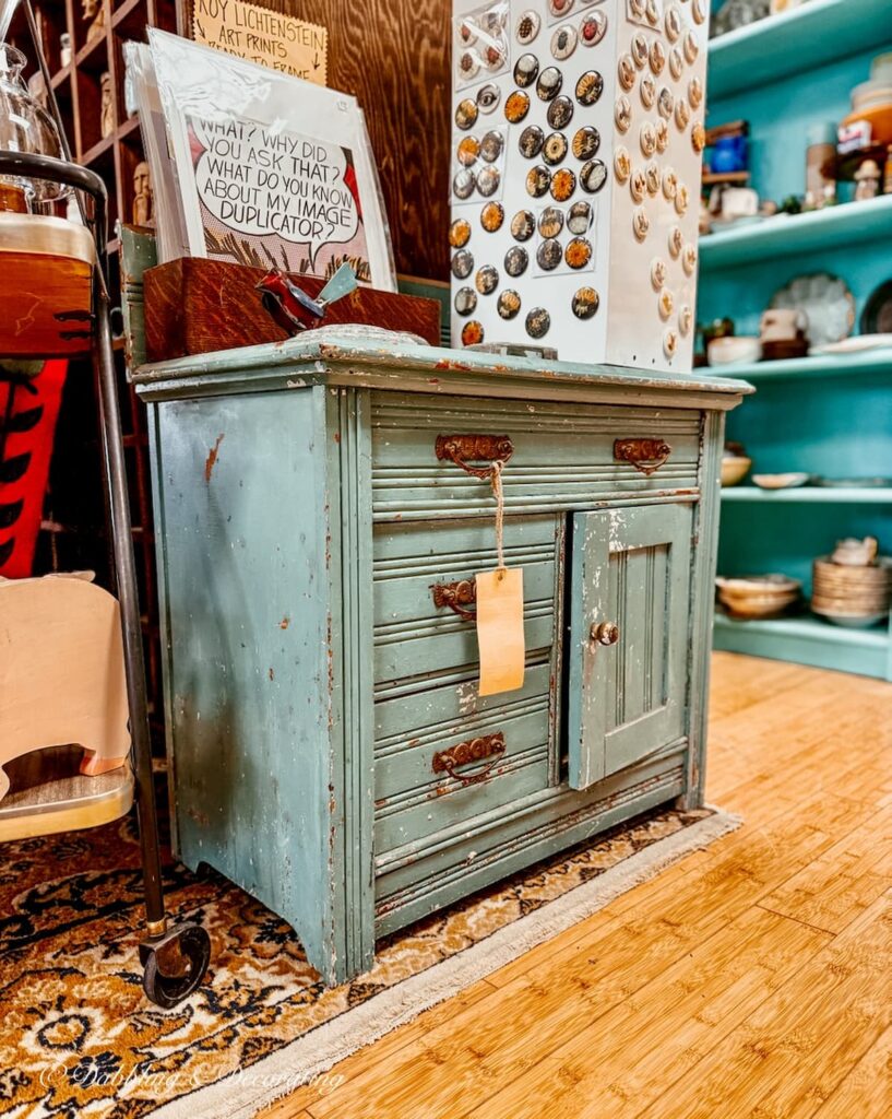 Small antique aqua painted dresser at The Vintage Inspired Market antiquing in Burlington, Vermont.