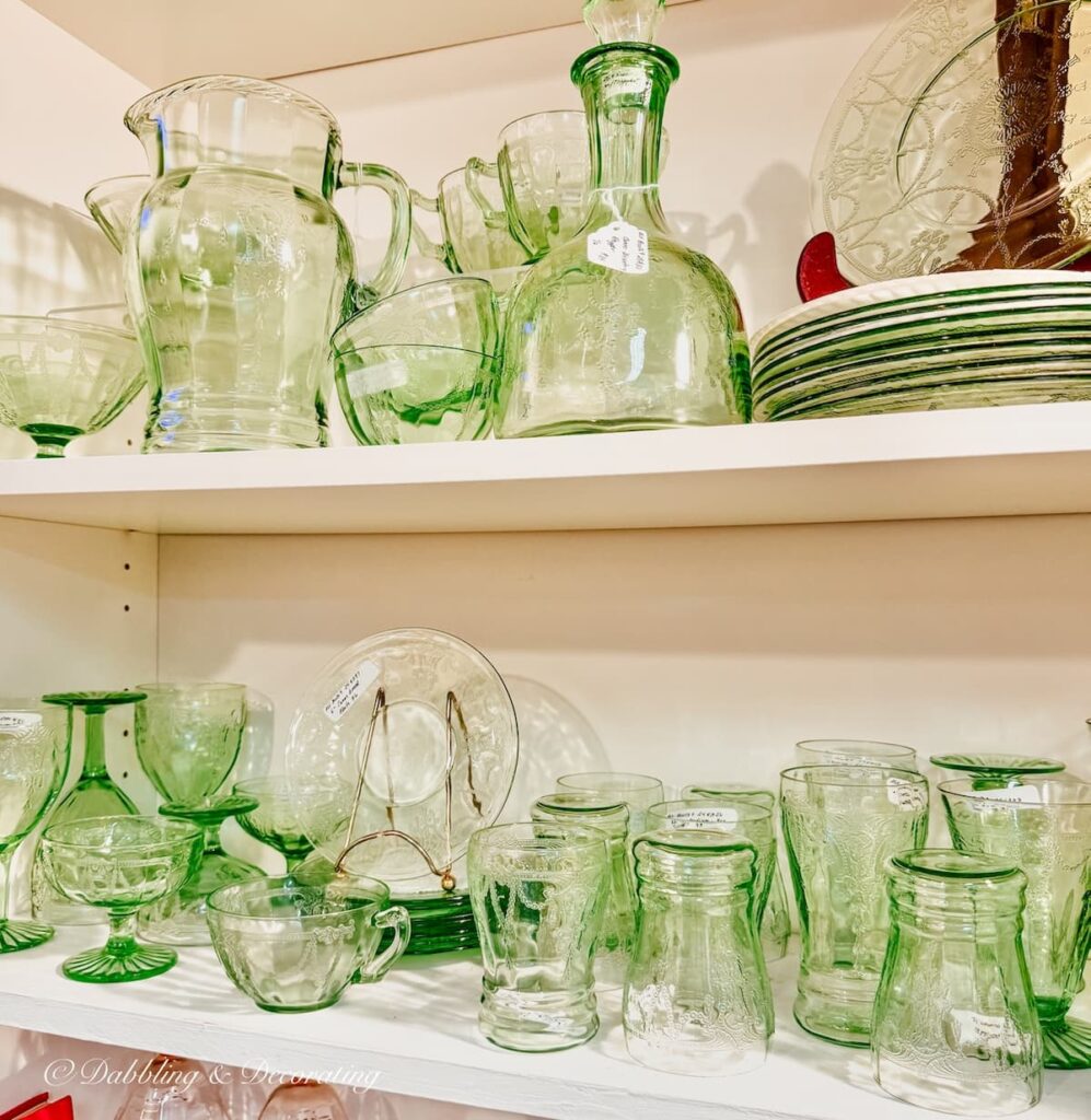 Green depression glass collection on display at The Vintage Inspired Marketplace antiquing in Burlington, Vermont.