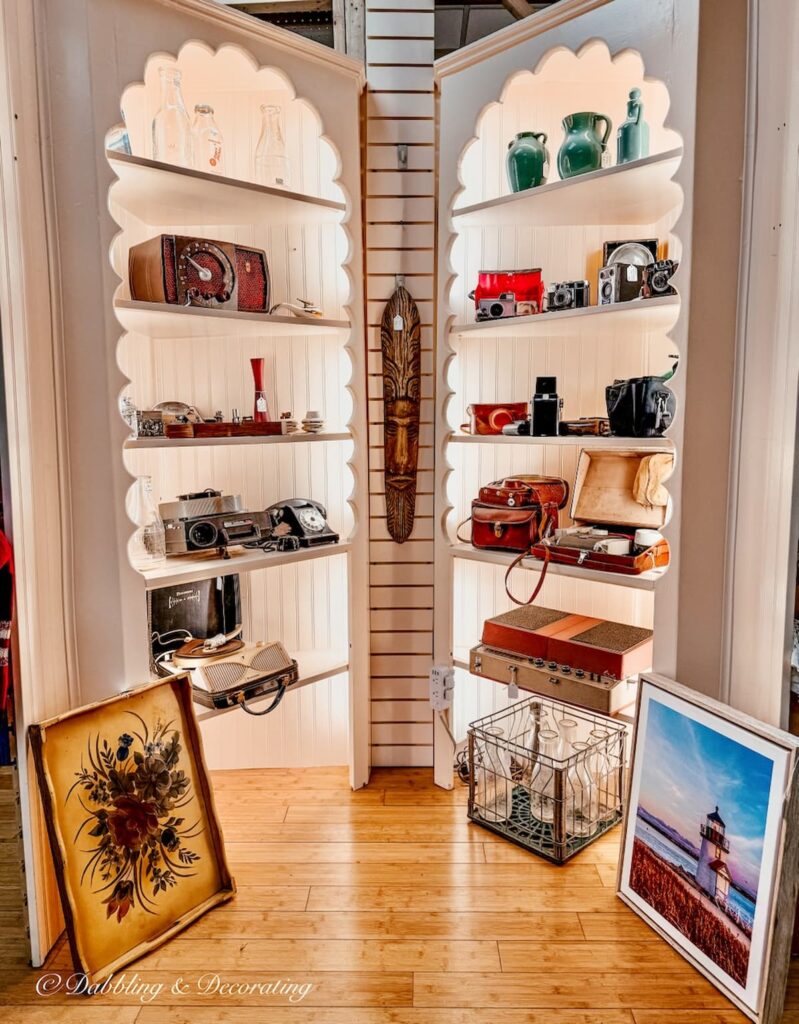 Beautifully curated vintage booth display inside The Vintage Inspired Marketplace antiquing in Burlington, Vermont.