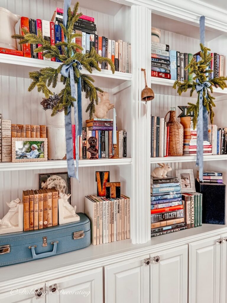 Christmas bookshelf decor ideas with eclectic and vintage charm for the holidays.