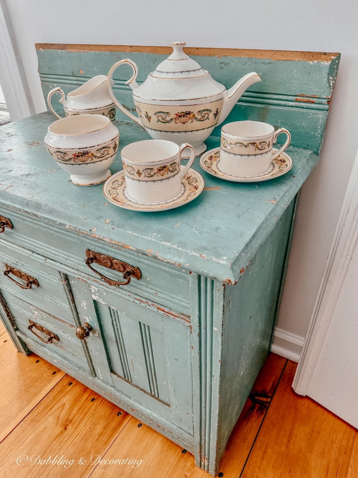 Small blue dresser with Aynsley's Banquet Tea set in vintage home decor.