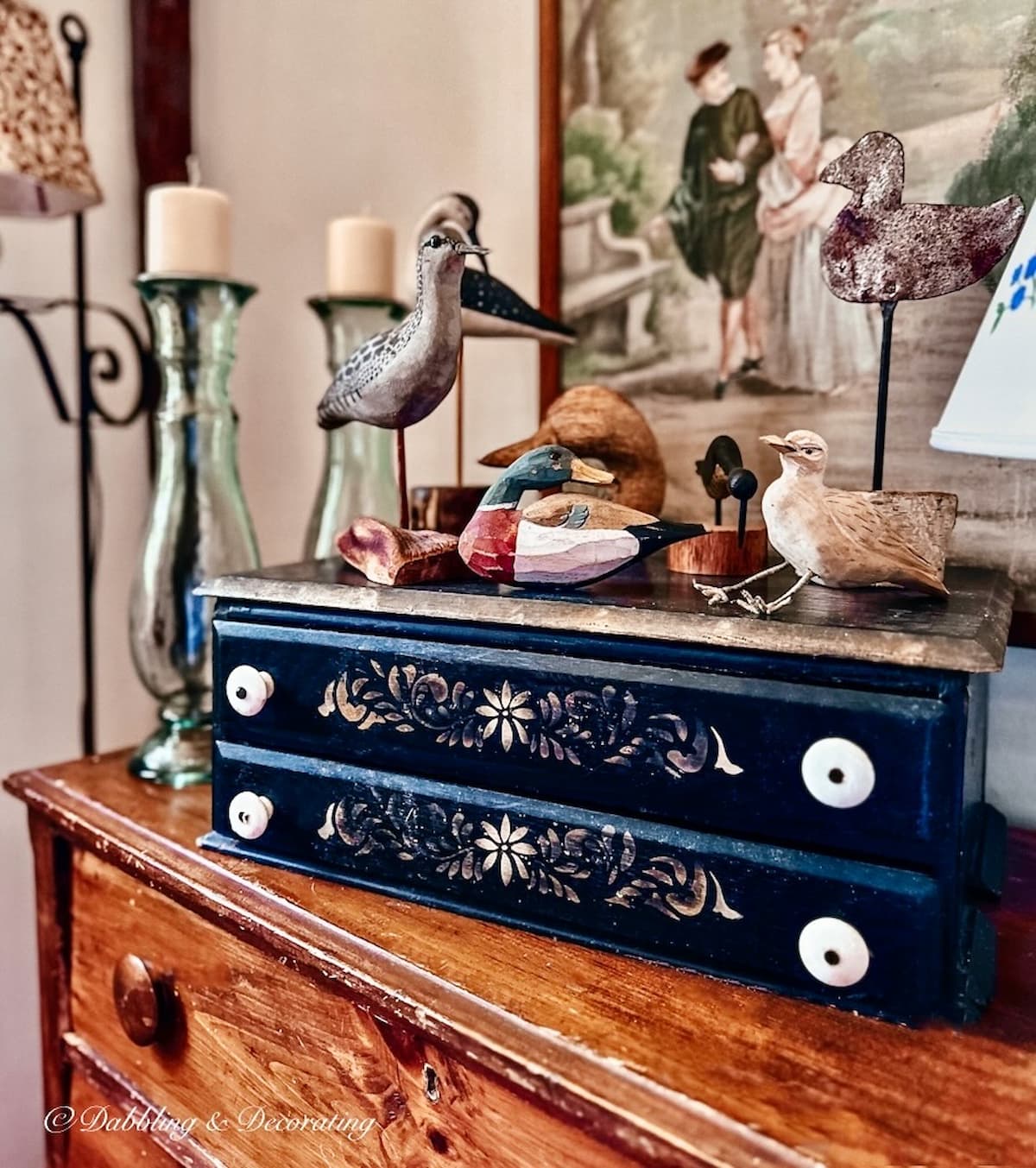 Nautical styled living room corner with vintage dresser decorating ideas with driftwood sea bird collection.