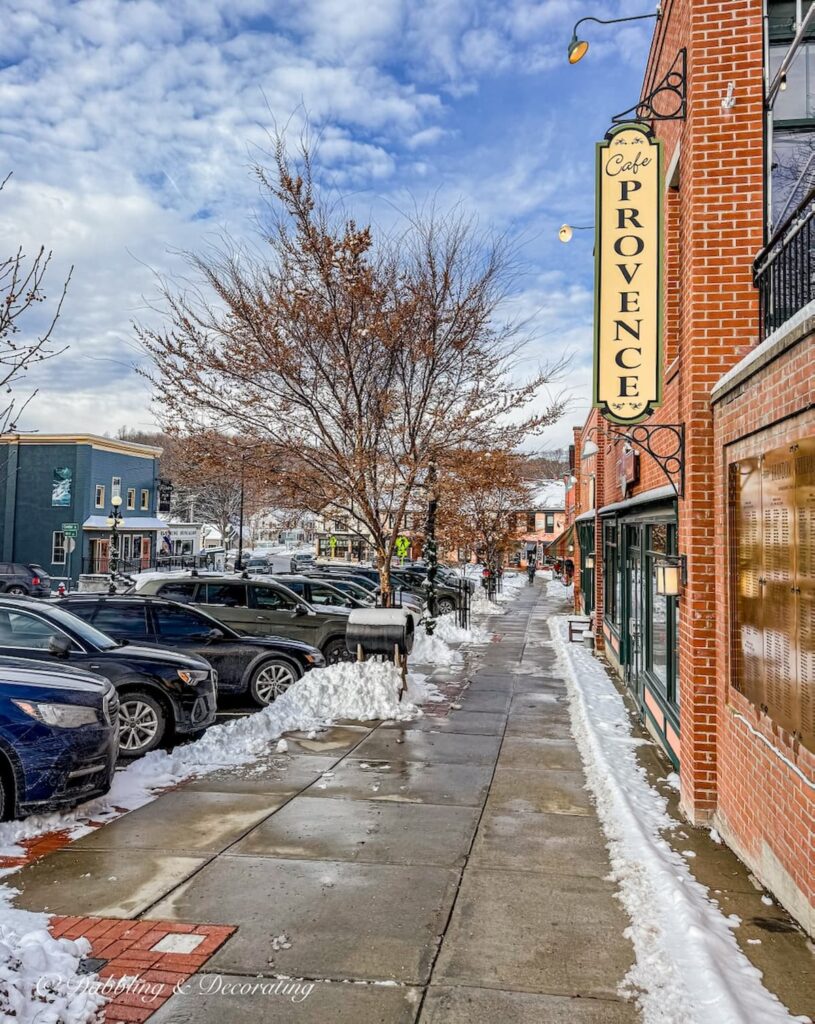 Cafe Provence sign from the streets of Brandon, Vermont on a snowy day.