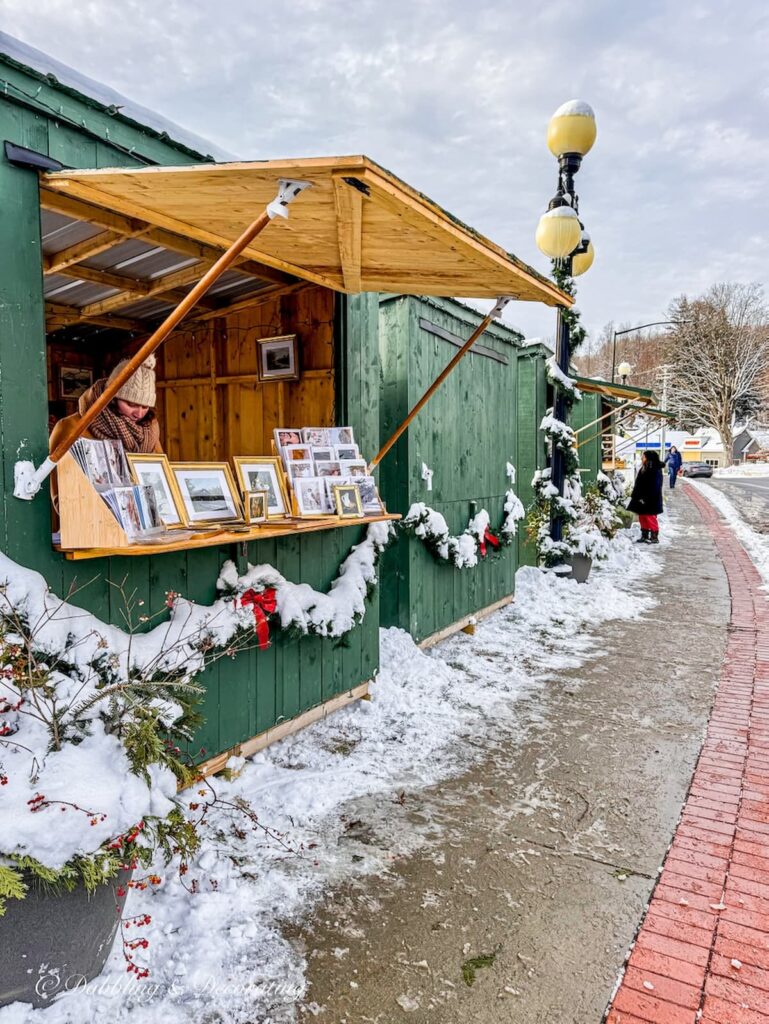 Outdoor shopping huts setting up for Midnight Madness in Brandon, Vermont.