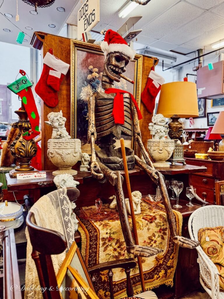A life like wooden skeleton with a santa hat and cigarette in an antique shops in Brandon, Vermont.