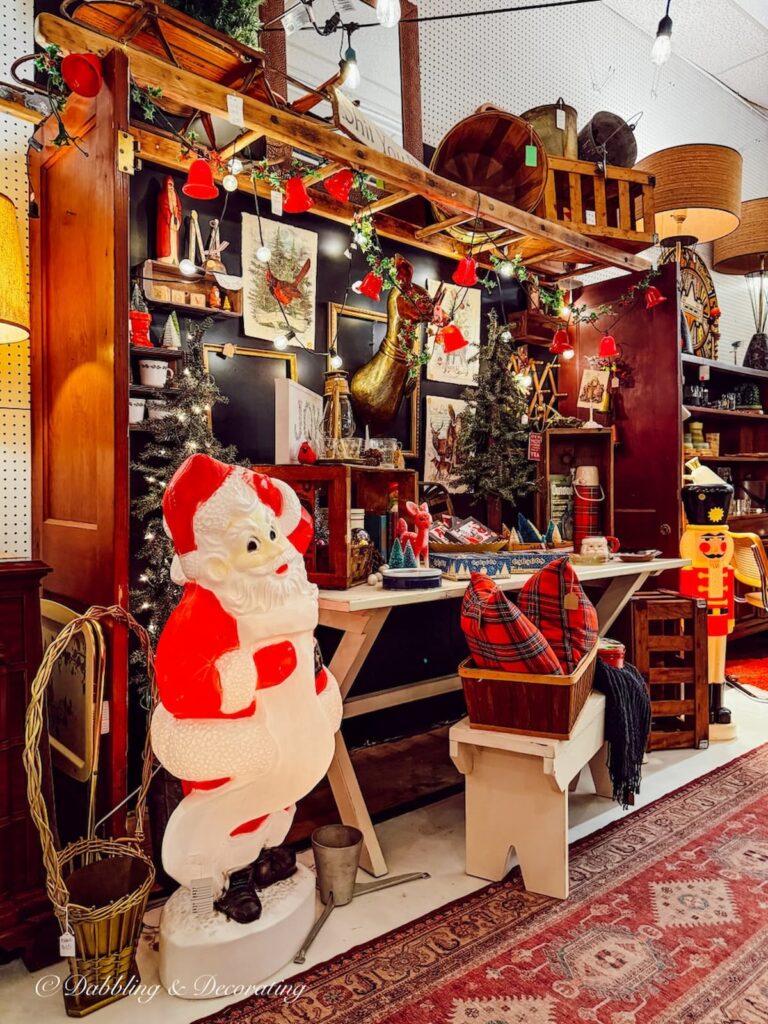 Inside Across the Street antiques in Brandon, Vermont Christmas display with vintage style.