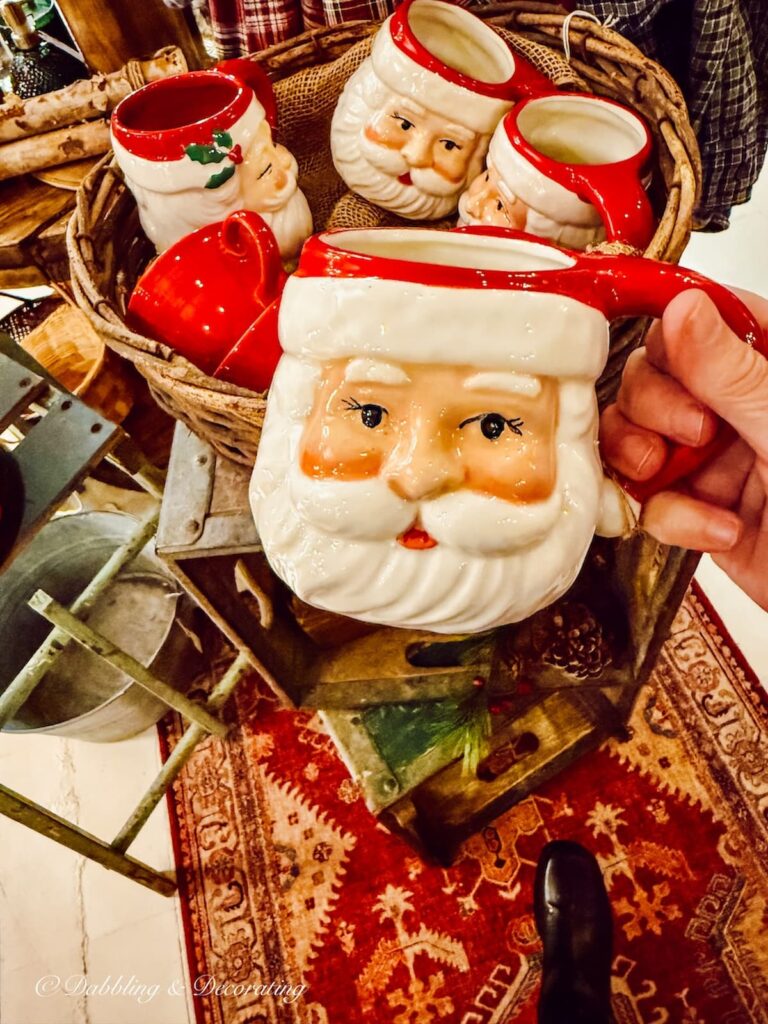 Vintage Santa mug in hand at antique shops in Brandon, Vermont.