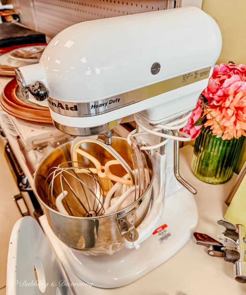 KitchenAid white mixer on the shelf at Goodwill Northern New England.