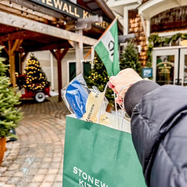 Stonewall Kitchen in York, Maine with a gift bag in hand for winter home decor ideas.