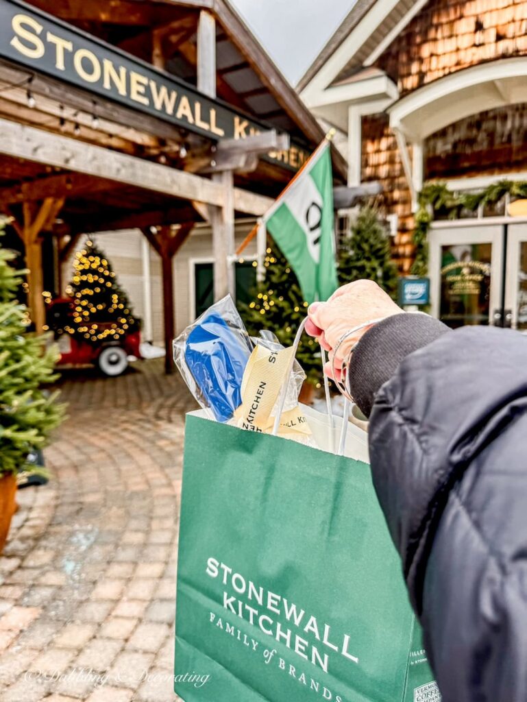 Stonewall Kitchen in York, Maine with a gift bag in hand for winter home decor ideas.