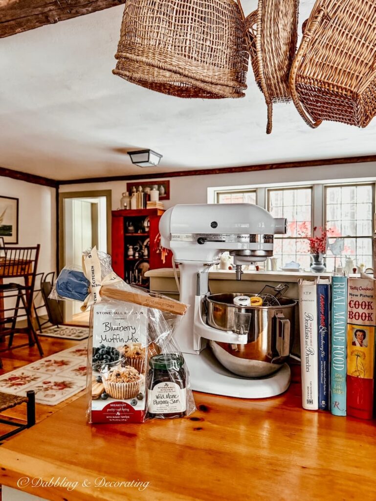 White large thrifted KitchenAid from Goodwill Northern New England on wooden country kitchen counter in vintage winter home decor.