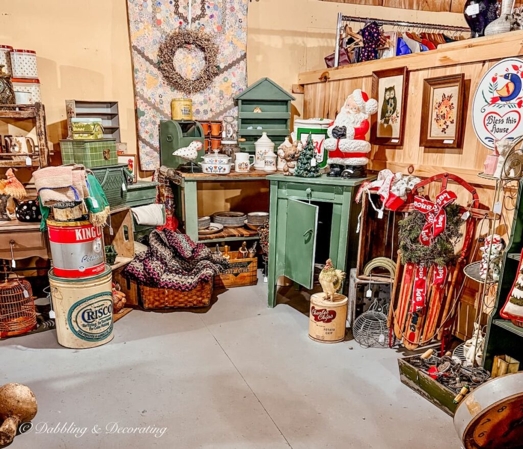 Country Christmas style vintage booth display at The Willows Flea Market in Maine.