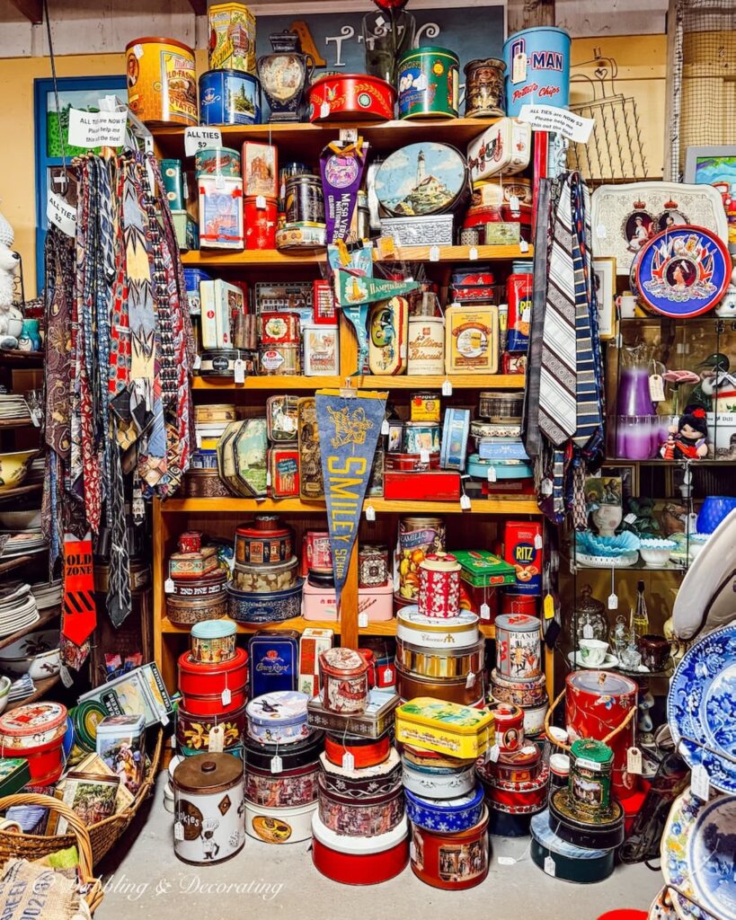Vendor display the Willows flea market in Maine filled with vintage tins.