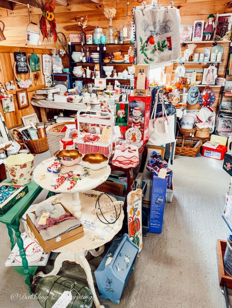 Eclectic vintage home decor vendor booth at The Willows, Maine's largest indoor flea market.