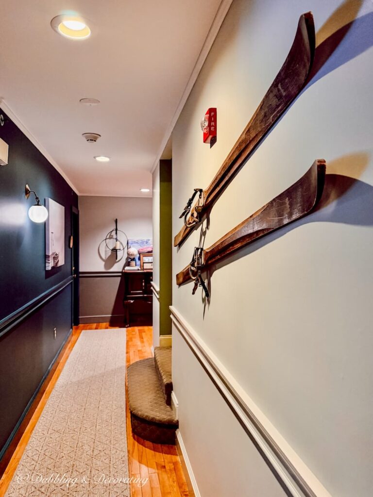 Vintage wooden skis on a hallway wall at the Wolf Cove Inn in Poland, Maine.