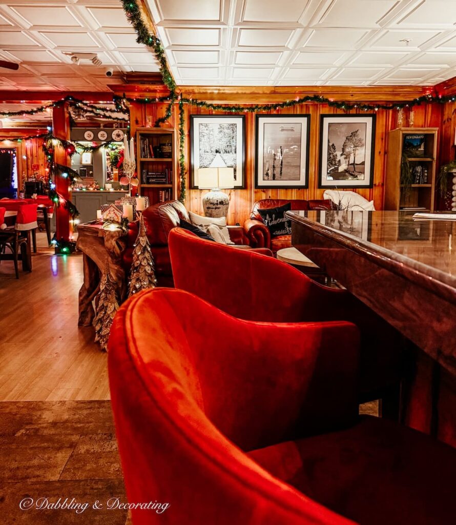 The velvet red chairs view from the bar at The Wolf Cove Inn in Poland Maine at Christmas time.