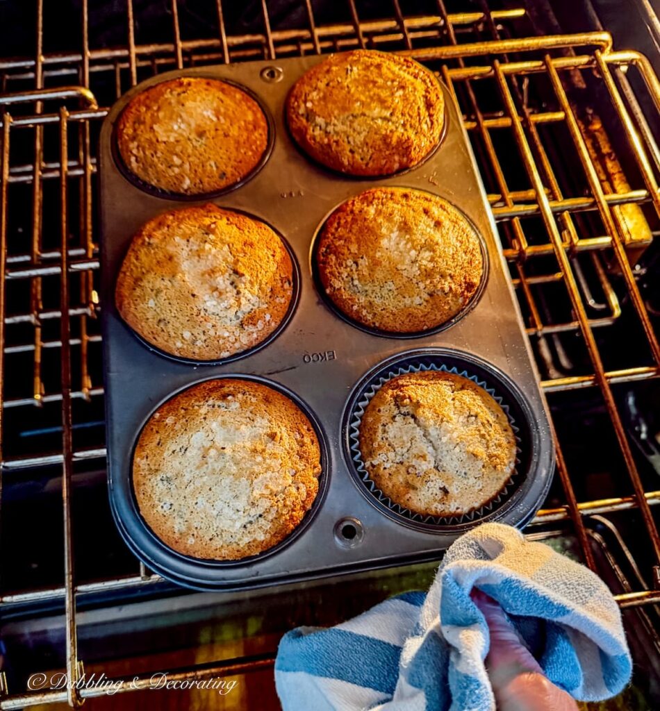Blueberry Muffins baked in a thrifted tin just coming out of the oven on a cozy winter day.