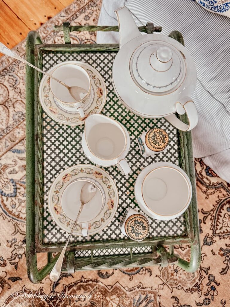 Aynsley Banquet 7 piece tea set on antique tea cart in living room. A view looking down.