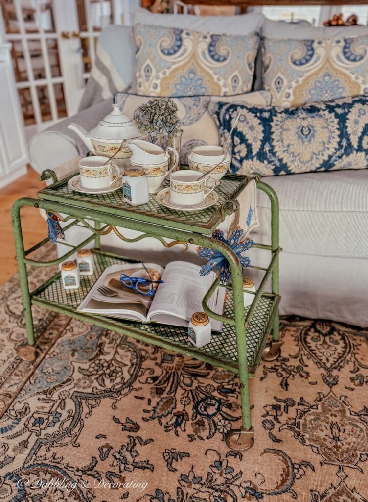 Tea cart styling ideas with antique beverage cart and Ansley's Banquet Tea set in cozy living room.