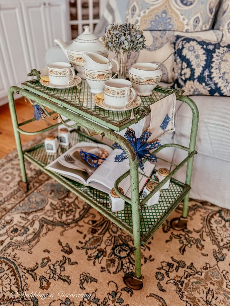 Tea cart styling ideas with antique beverage cart and Ansley's Banquet Tea set in cozy living room.
