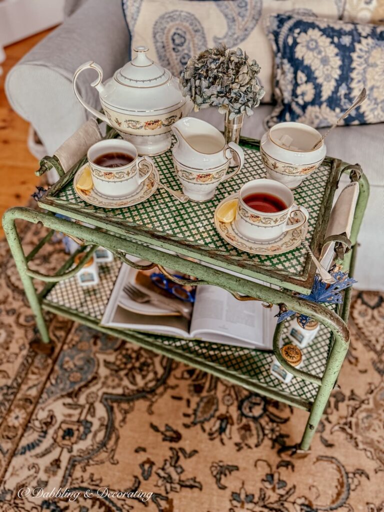 Tea cart styling ideas with antique beverage cart and Ansley's Banquet Tea set in cozy living room.