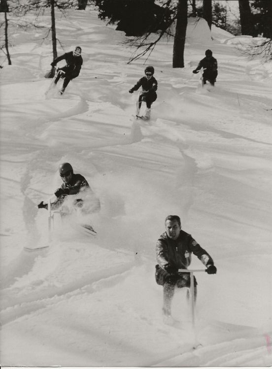 Old Fashioned photo of people skiing down the French Alps on Ski Bobs.
