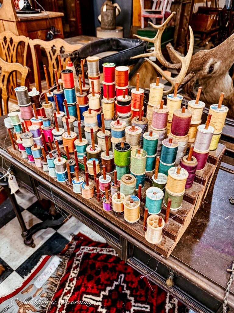 Large sewing thread display at vendor booth at the Vermont Antique Mall.