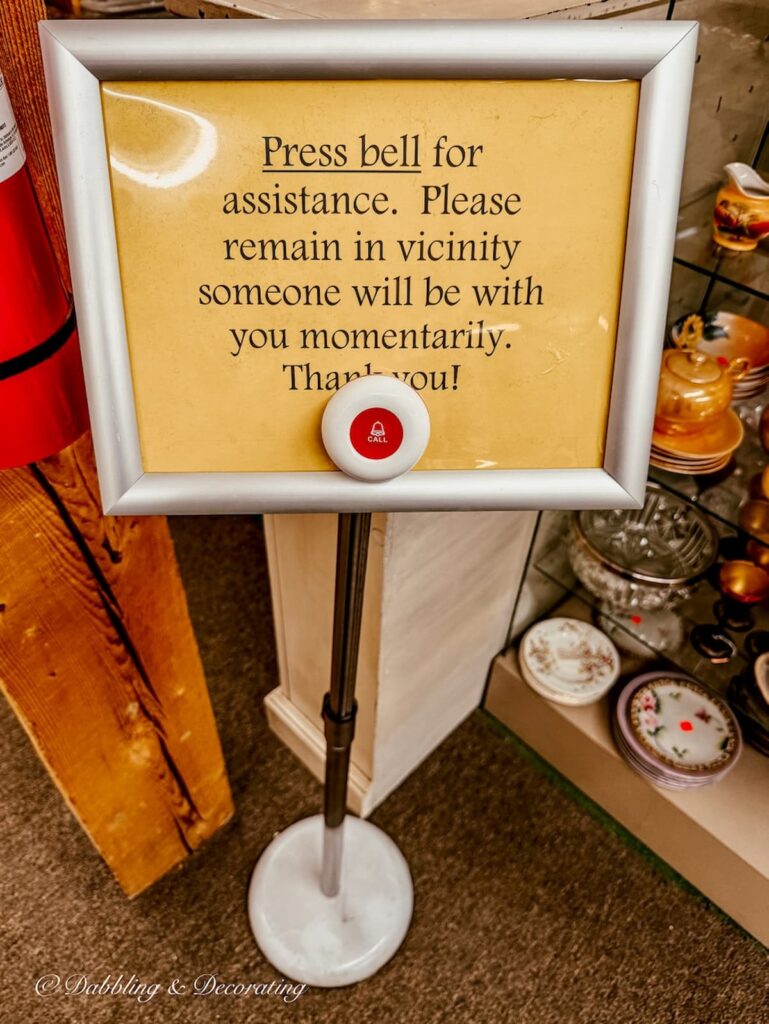 Press Bell for assistance. Please remain in vicinity someone will be with you momentarily. Thank you with call button sign at Vermont Antique Mall